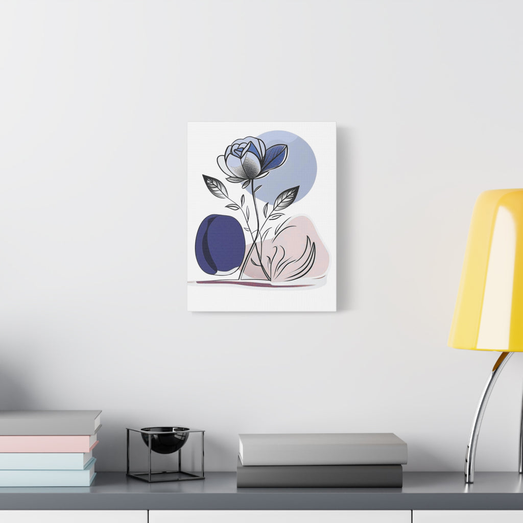 Abstract floral artwork on a wall above a desk with books and a lamp.