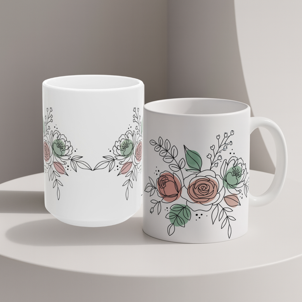 Two white mugs in different positions with floral designs on a neutral background