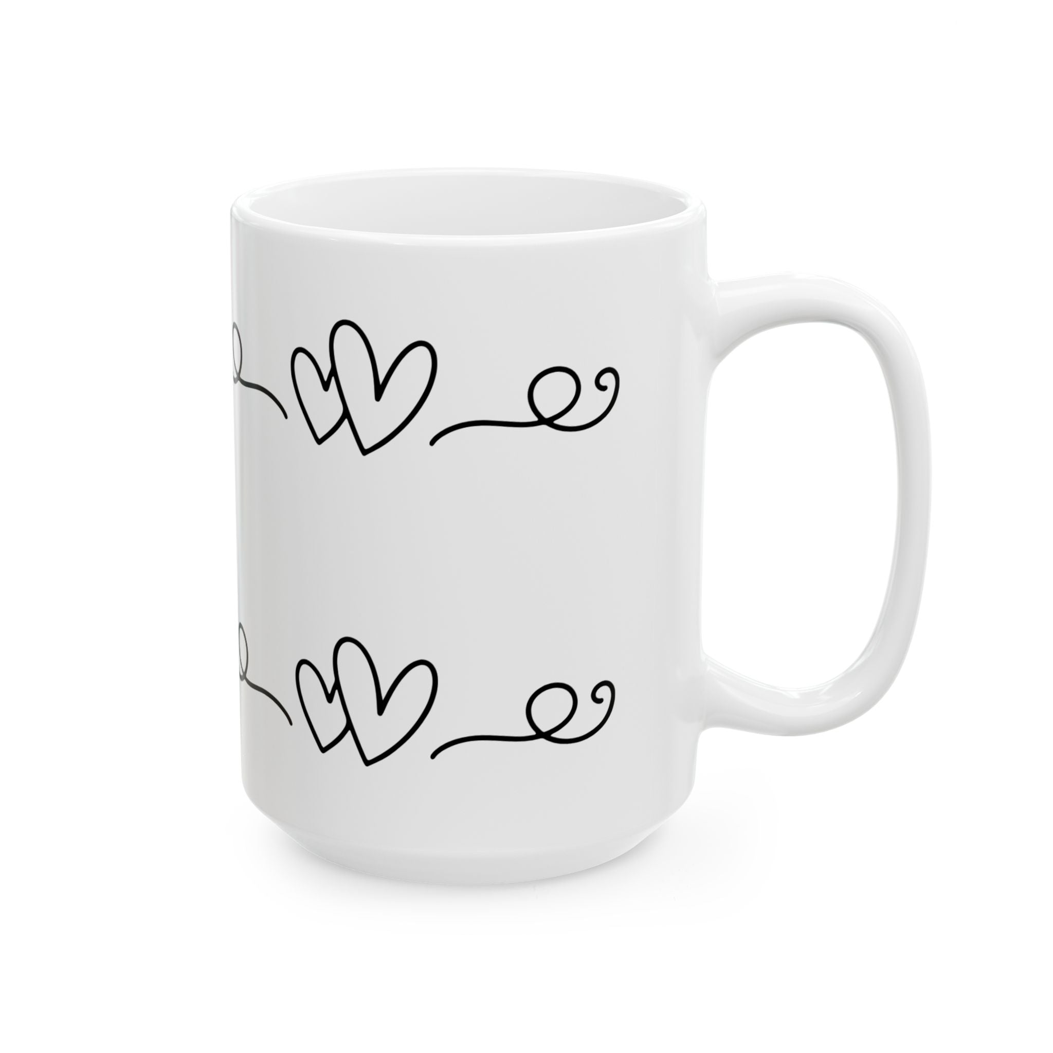White mug with black heart designs on a white background