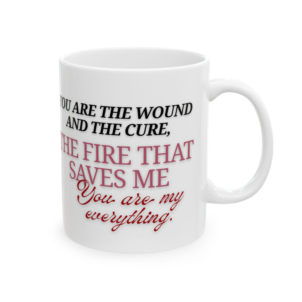 White mug with black and red text on a white background