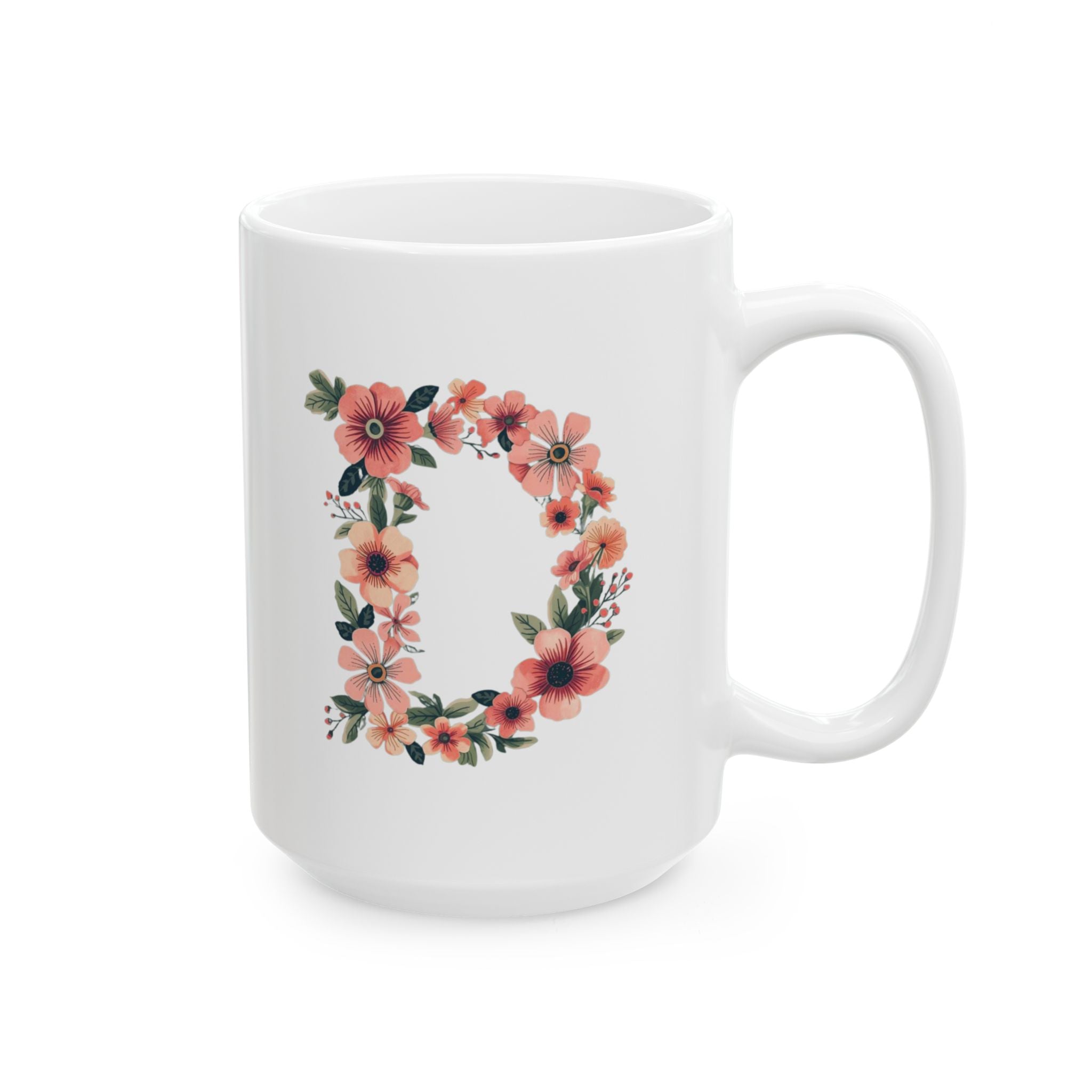 White mug with floral letter 'D' design on a white background