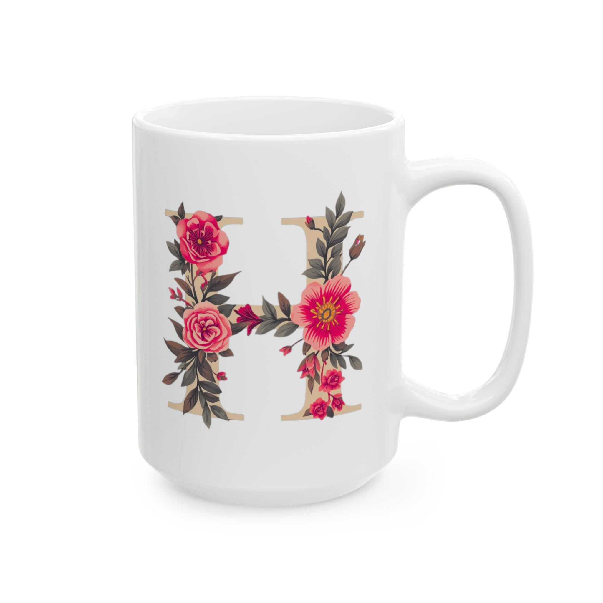 White mug with floral letter 'H' design on a white background