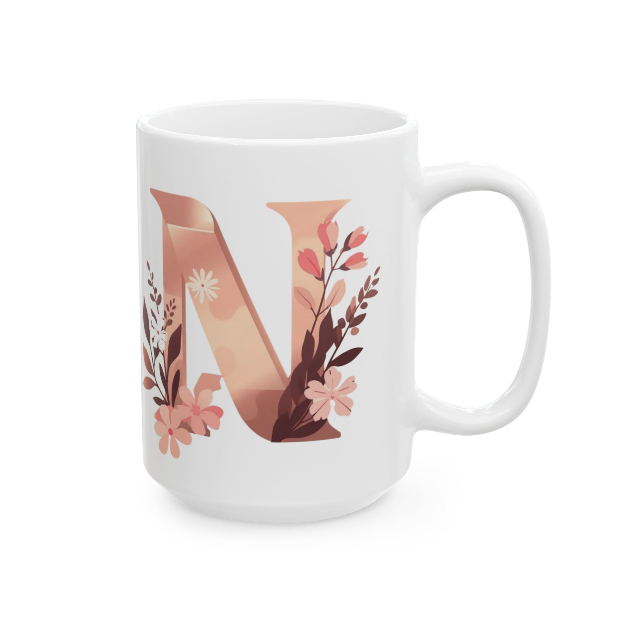 White mug with a floral letter 'N' design on a white background