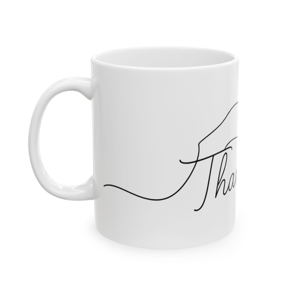 White mug with black text on a white background