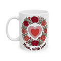 White mug with red floral design and heart, featuring 'Mom, with Love' text on a white background.