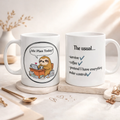 Two mugs with humorous designs on a light surface.