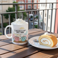 Mug with whipped cream and a slice of cake on a wooden table with a balcony view.