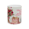 Mug with floral design, gift box, and text on a white background