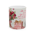 Mug with floral design, gift box, and text on a white background