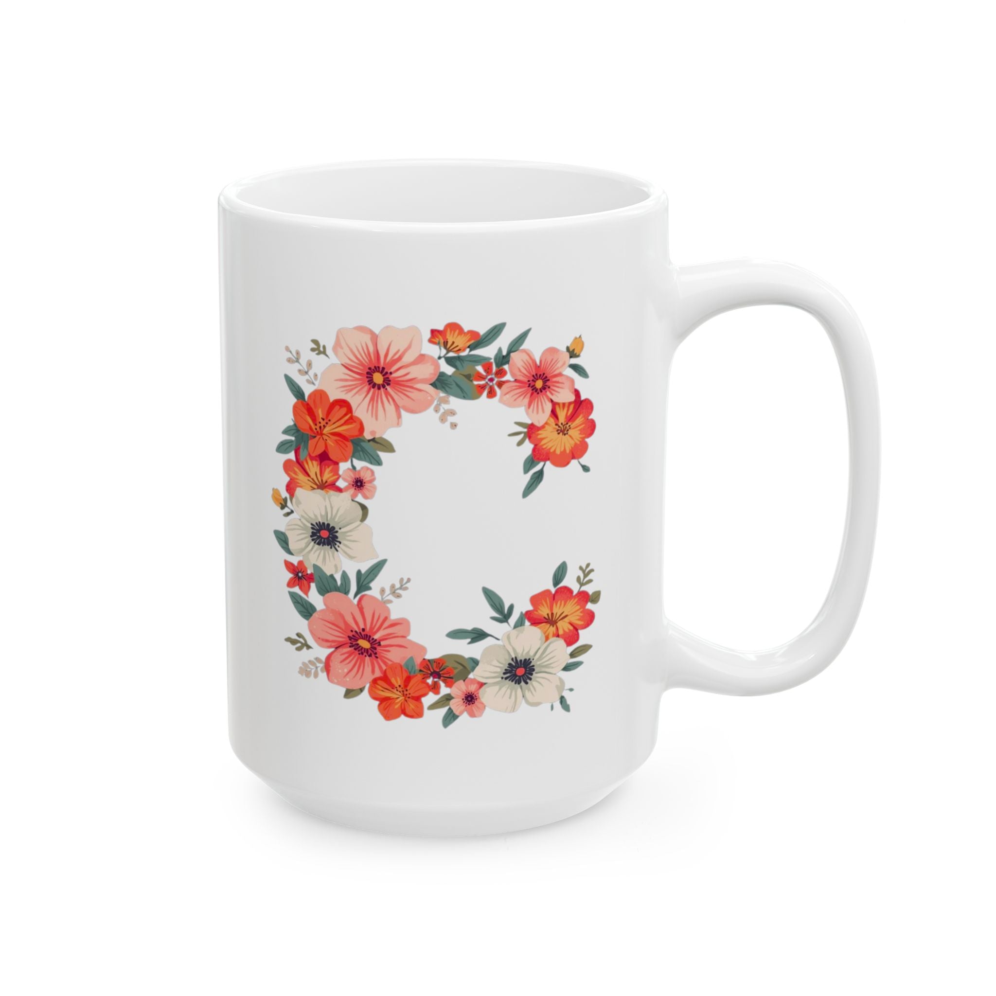 White mug with floral C design on a white background