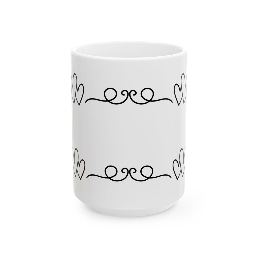 White mug with black decorative heart and swirl pattern on a white background