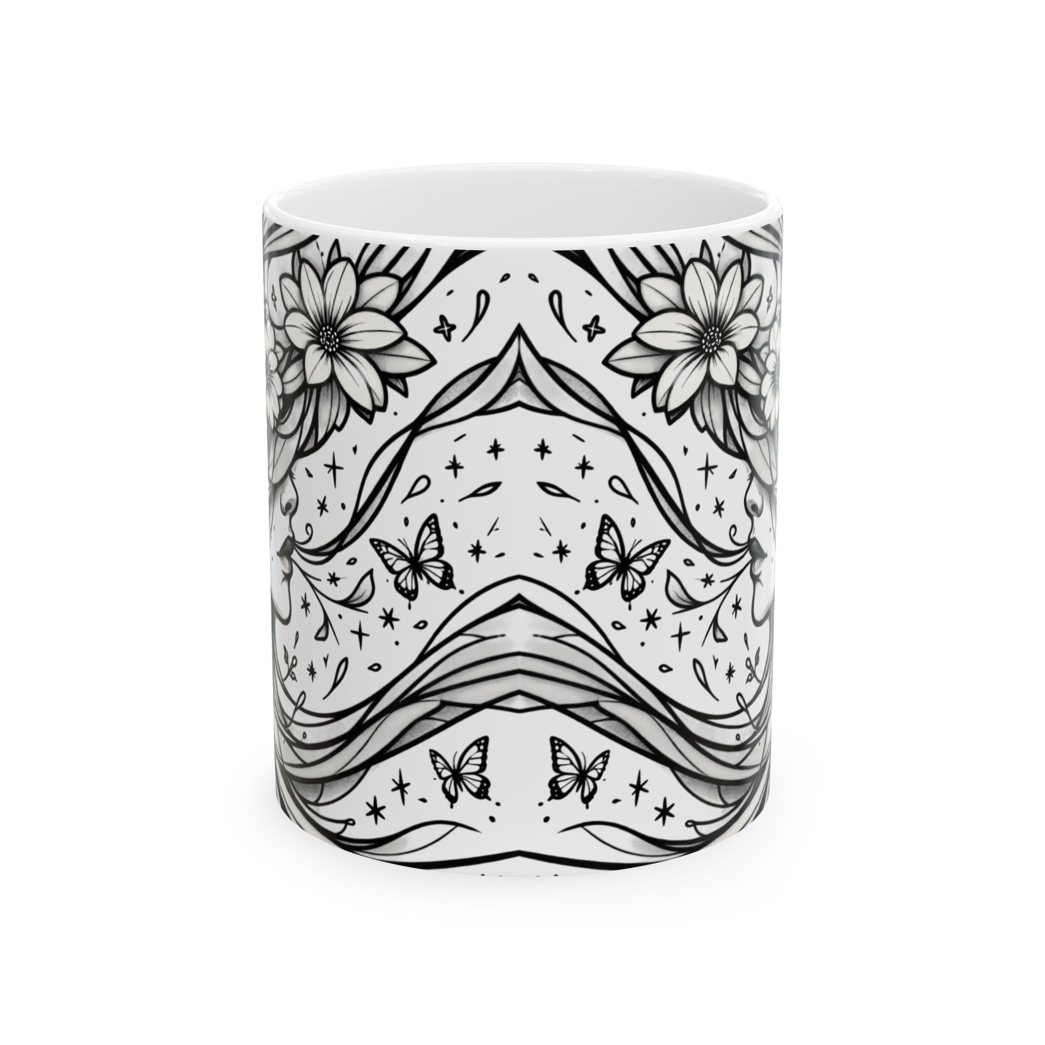 White mug with black floral and butterfly pattern on a white background