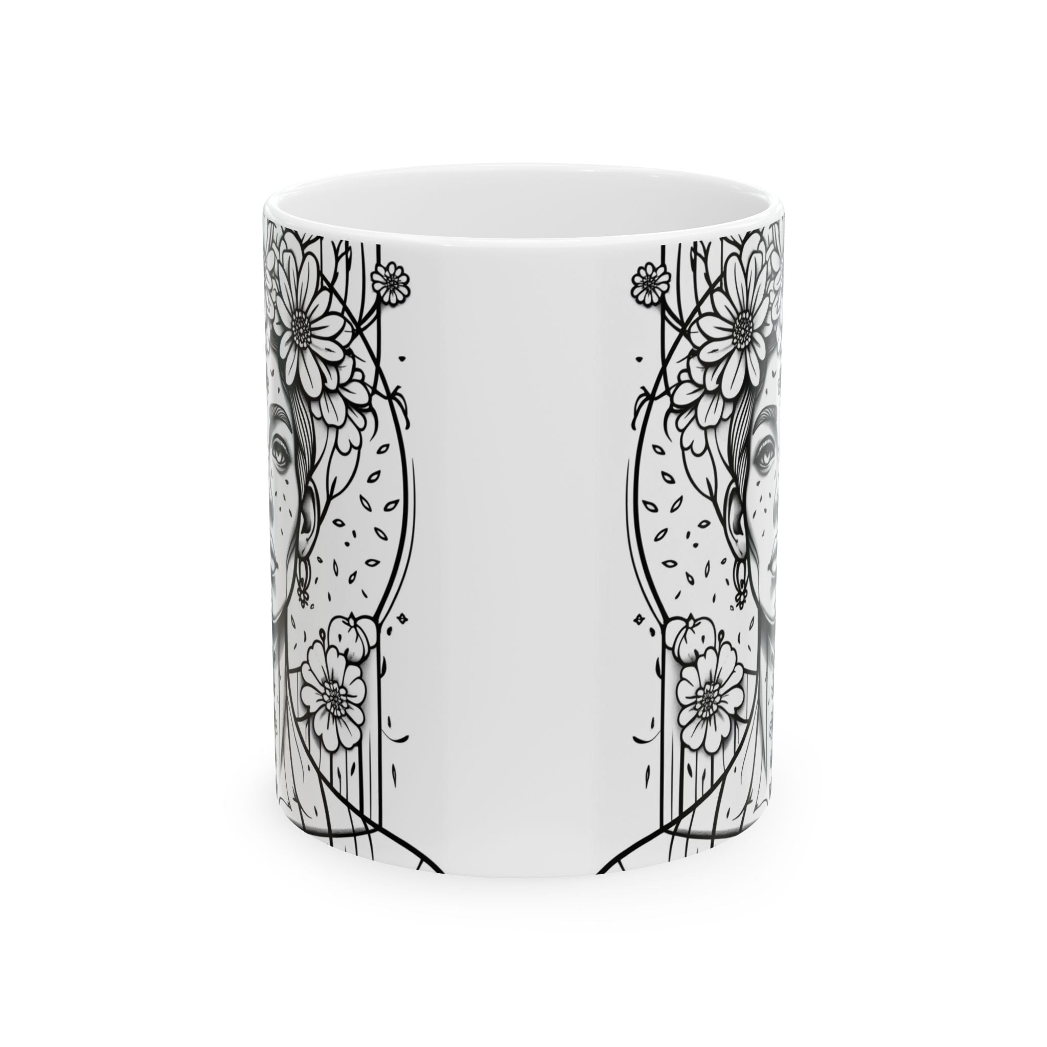 White mug with black floral and abstract designs on a white background